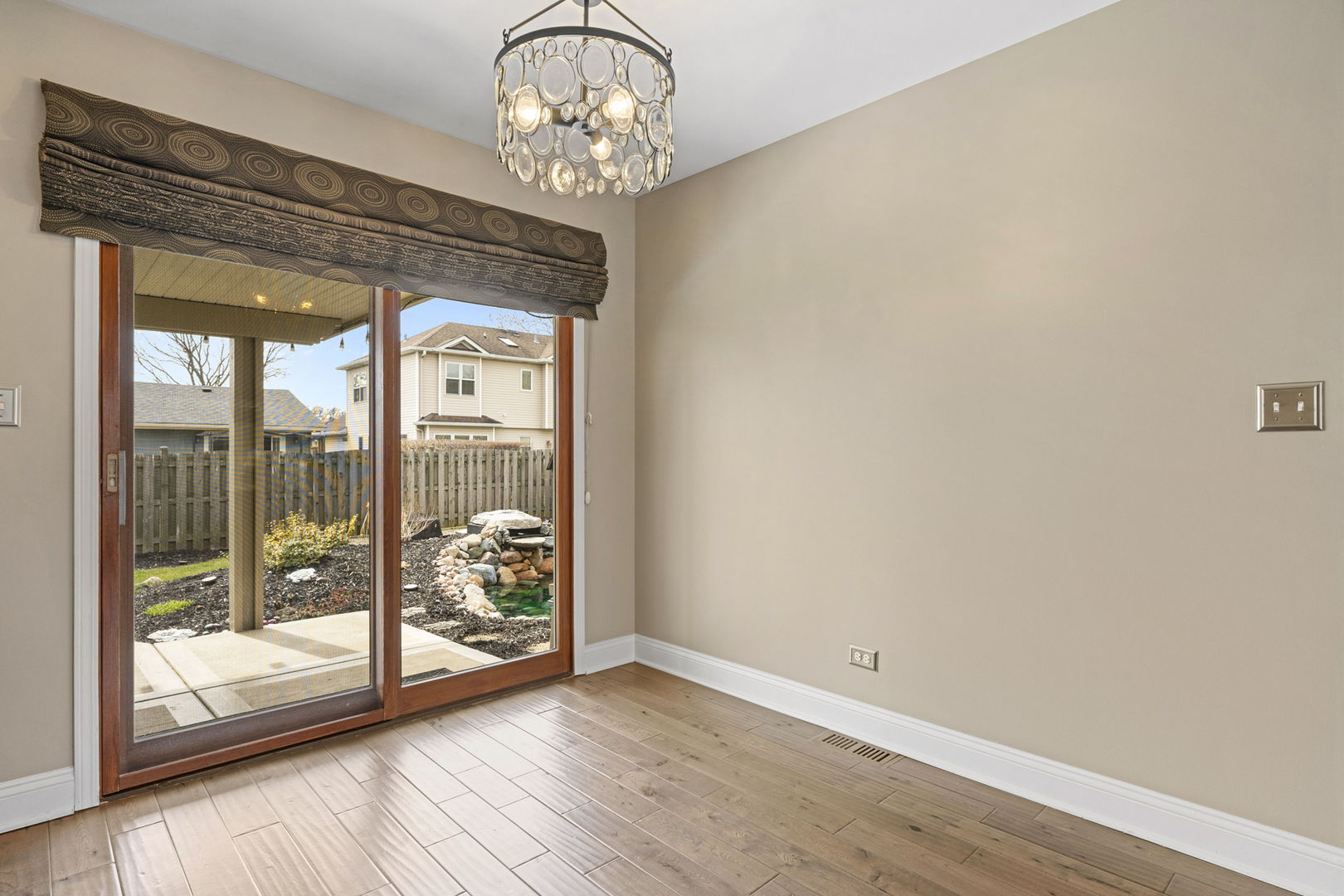 61 Avon Road Elk Grove Village, IL 60007 - Photo 12 of 41 a view of a room with wooden floor and balcony