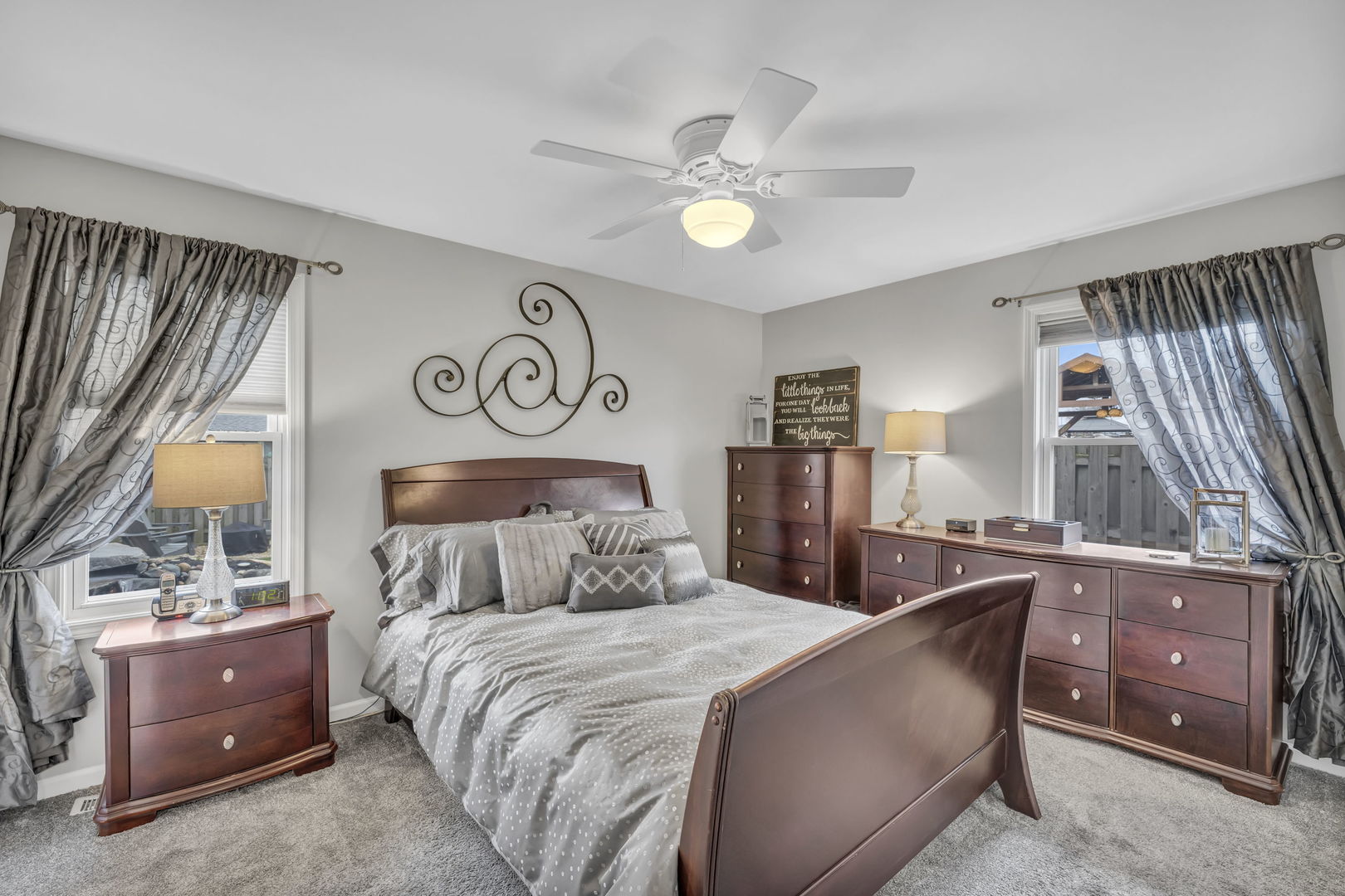 61 Avon Road Elk Grove Village, IL 60007 - Photo 14 of 41 a bedroom with a bed and a chandelier