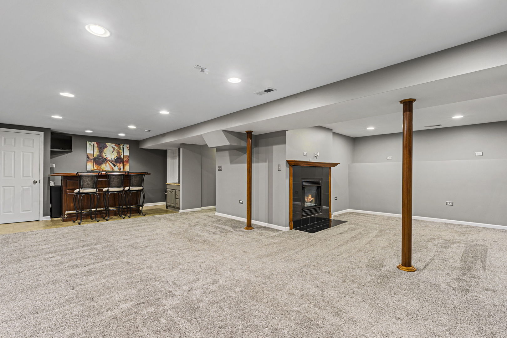61 Avon Road Elk Grove Village, IL 60007 - Photo 27 of 41 a view of an empty room with furniture and a fireplace
