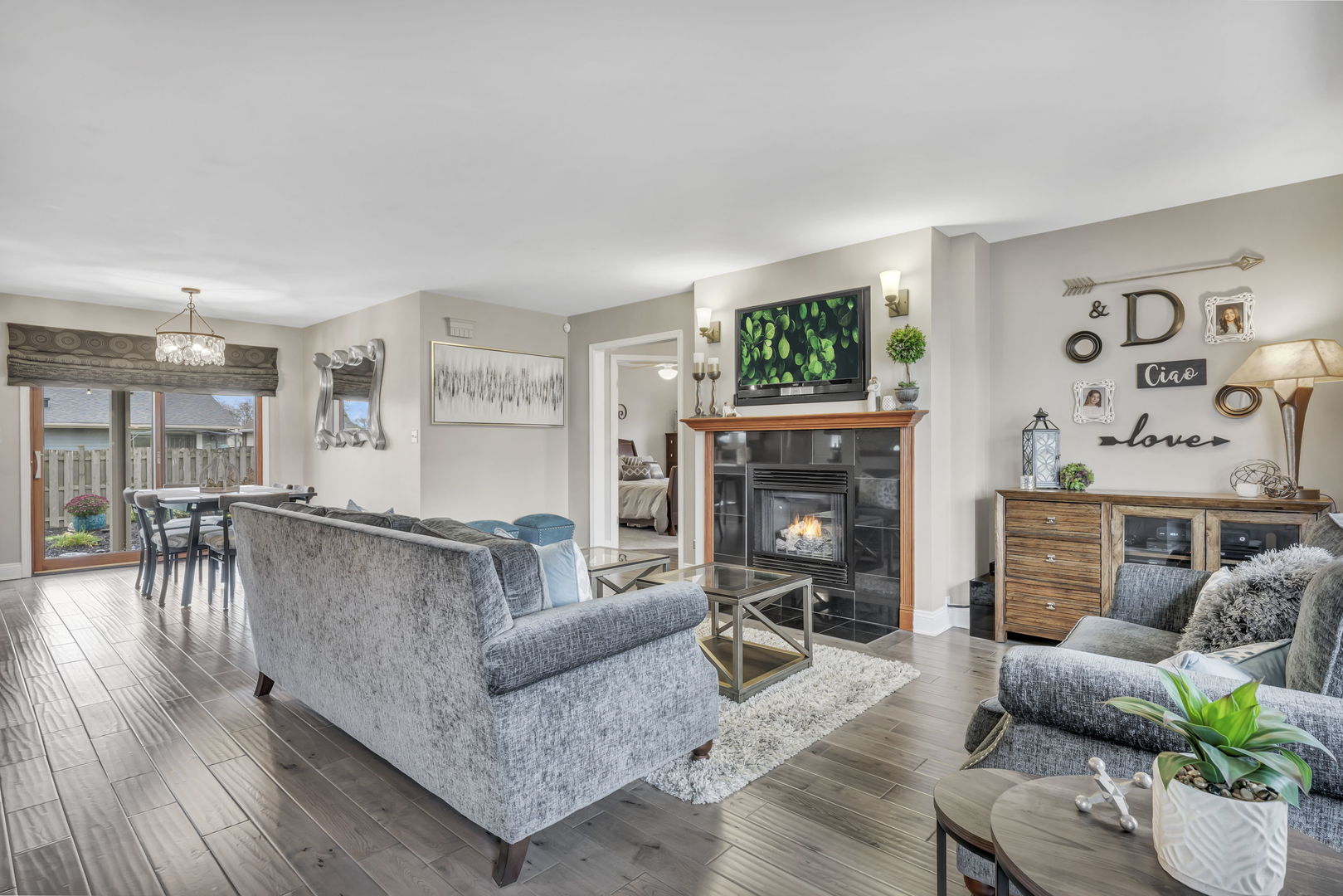 61 Avon Road Elk Grove Village, IL 60007 - Photo 3 of 41 a living room with furniture and a fireplace