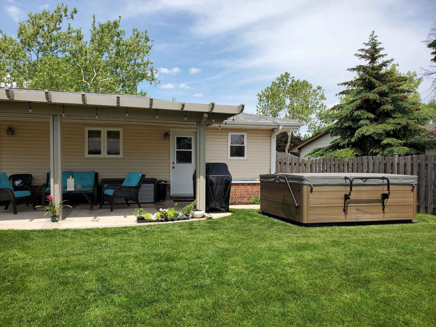 61 Avon Road Elk Grove Village, IL 60007 - Photo 32 of 41 a view of a chair and table in backyard of the house