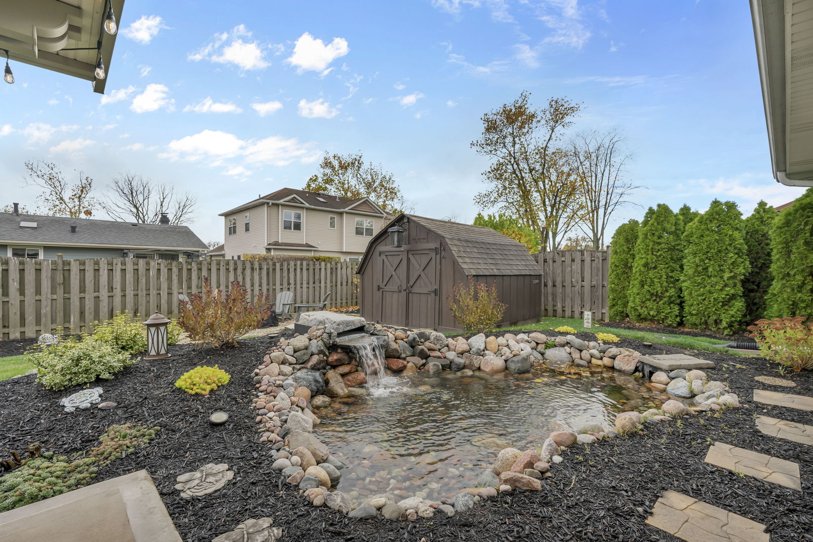 61 Avon Road Elk Grove Village, IL 60007 - Photo 34 of 41 a backyard of a house with table and chairs