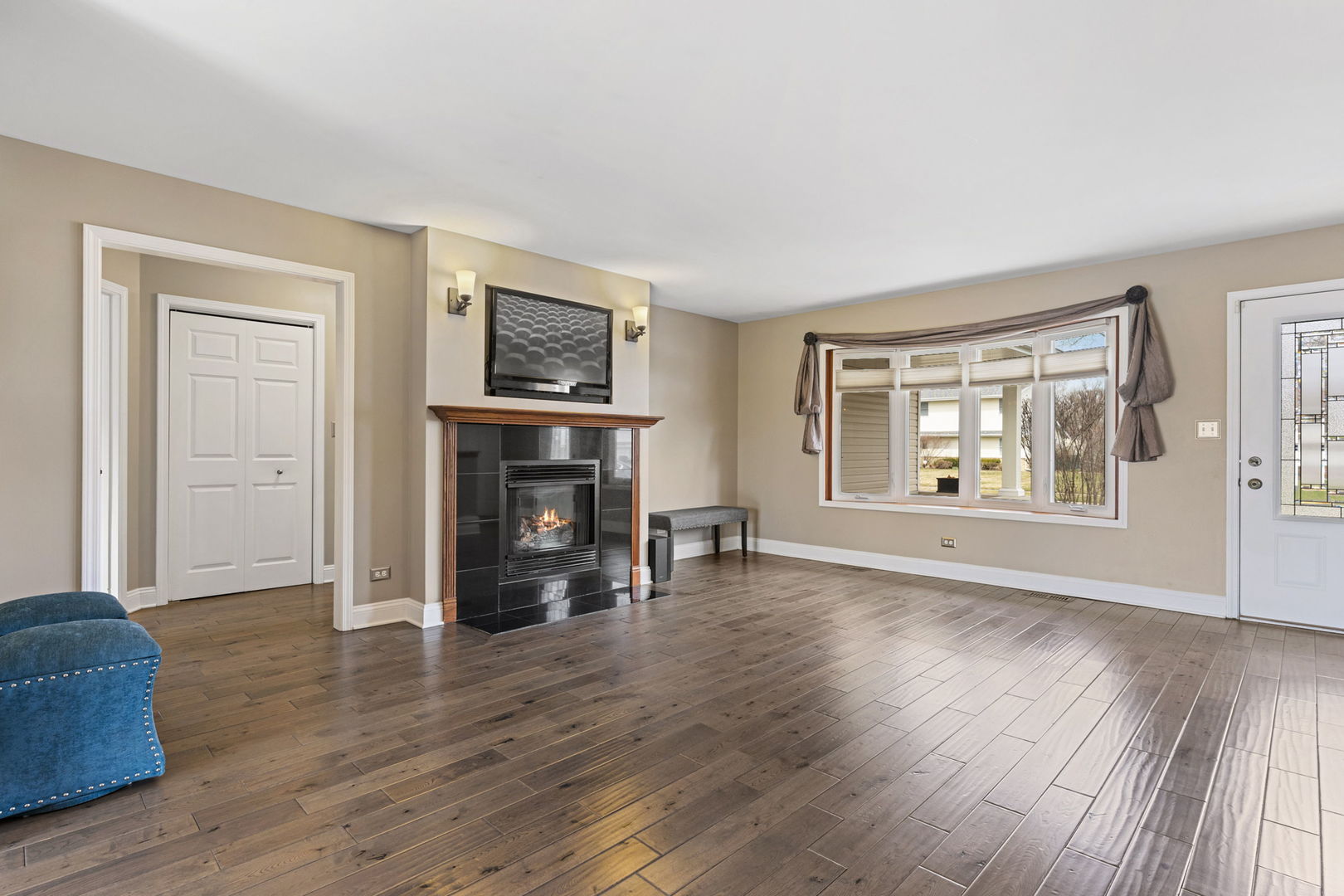 61 Avon Road Elk Grove Village, IL 60007 - Photo 6 of 41 a view of an empty room with window and fire place