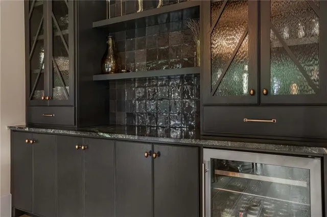 a kitchen with a stove and a refrigerator