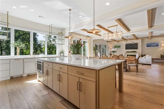 a bathroom with a double vanity sink mirror and bathtub