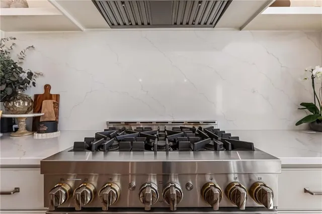 a spacious bathroom with a double vanity sink a large mirror and a bathtub