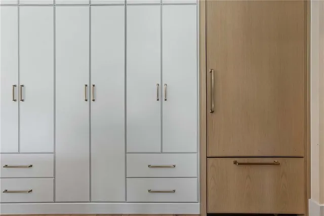 a bedroom with a bed and a potted plant