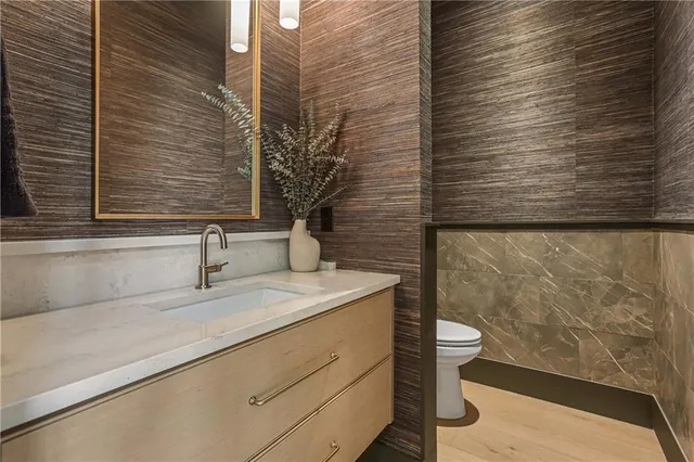 a living room with stainless steel appliances kitchen island furniture and a kitchen view