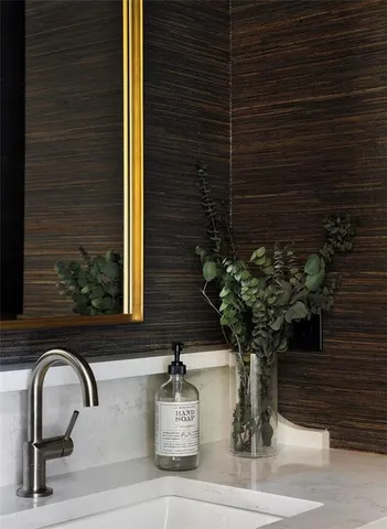 a living room with furniture and a kitchen