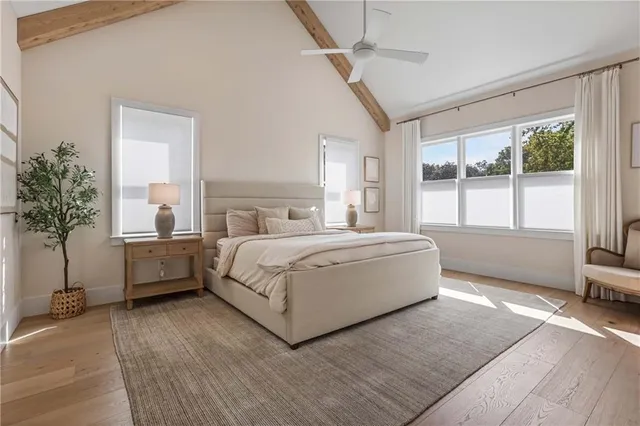 a spacious bedroom with a bed and a couch