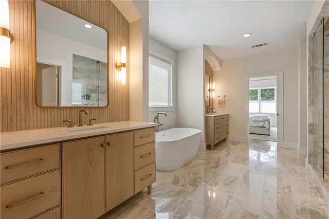 a view of a roof deck with table and chairs with wooden floor and fence