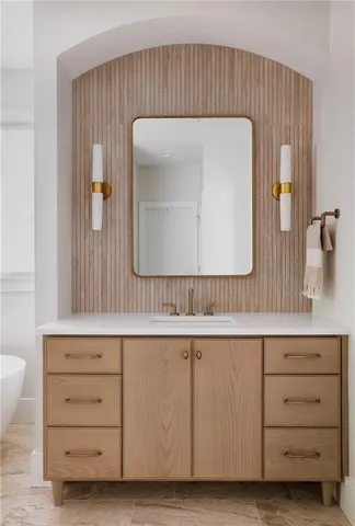 a view of a chair and table in backyard of the house