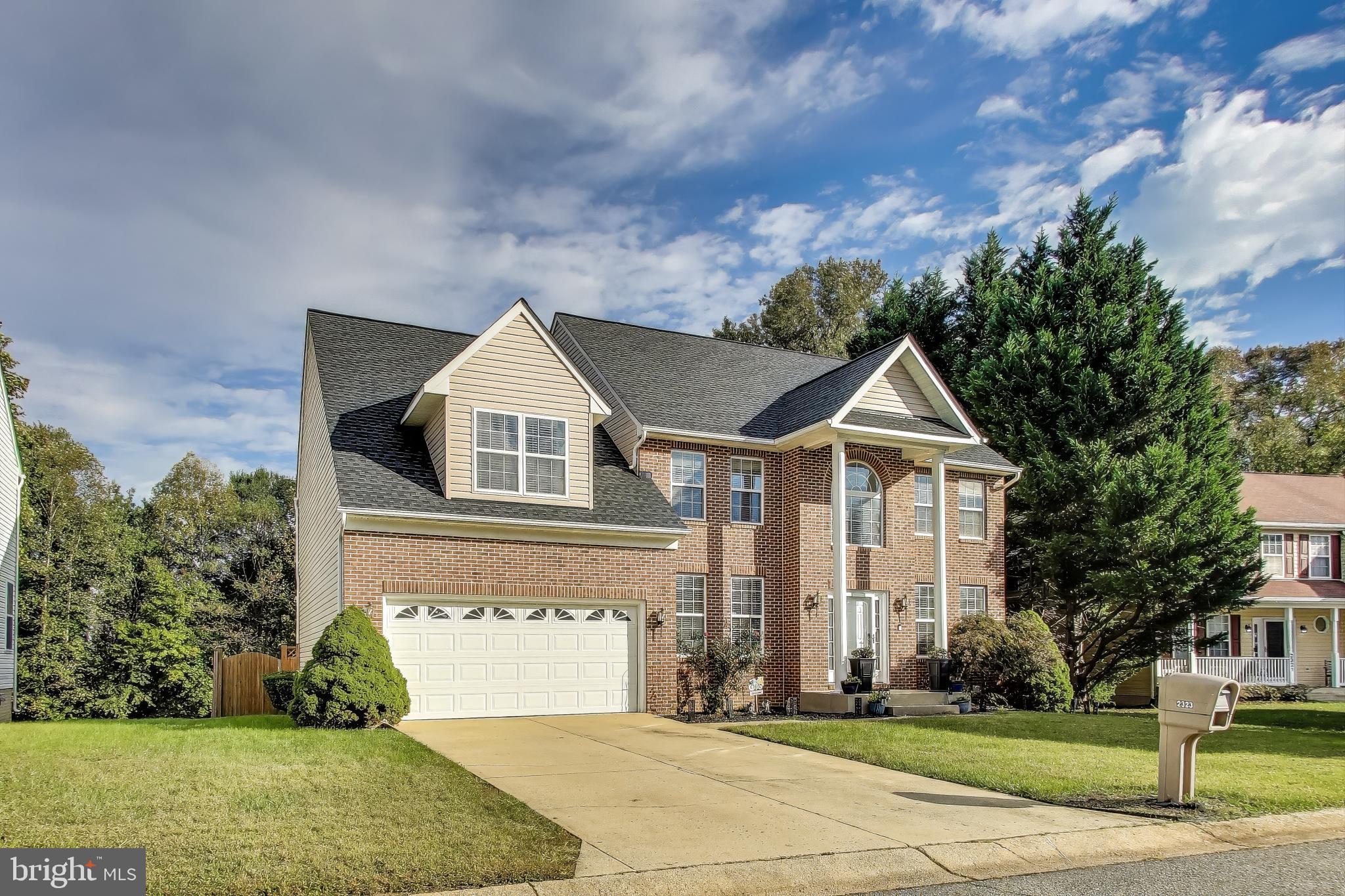 2323 Springdale Lane Waldorf, MD 20603 - Photo 1 of 51 a front view of a house with a yard