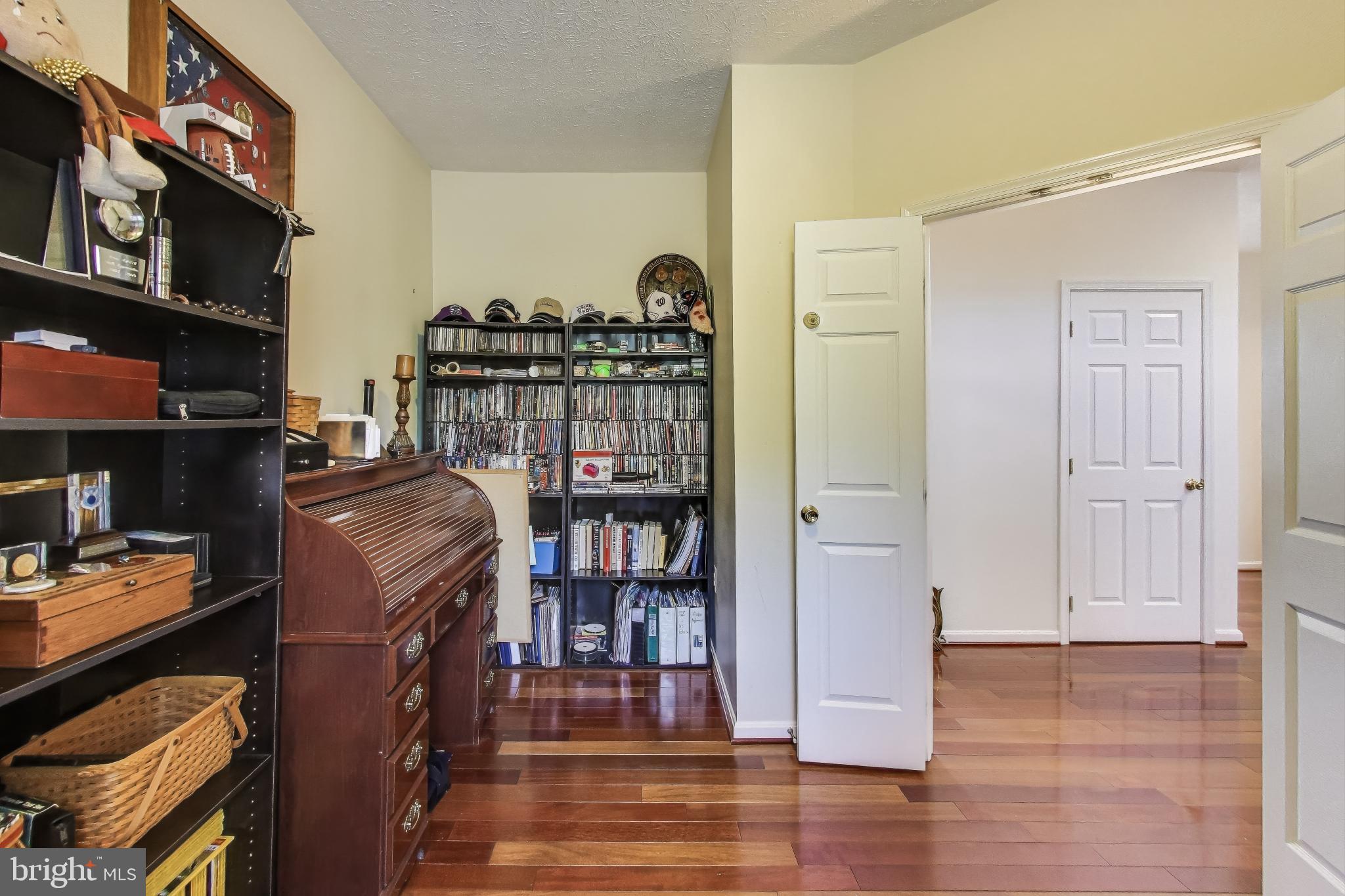 2323 Springdale Lane Waldorf, MD 20603 - Photo 18 of 51 a view of a workspace with furniture and wooden floor