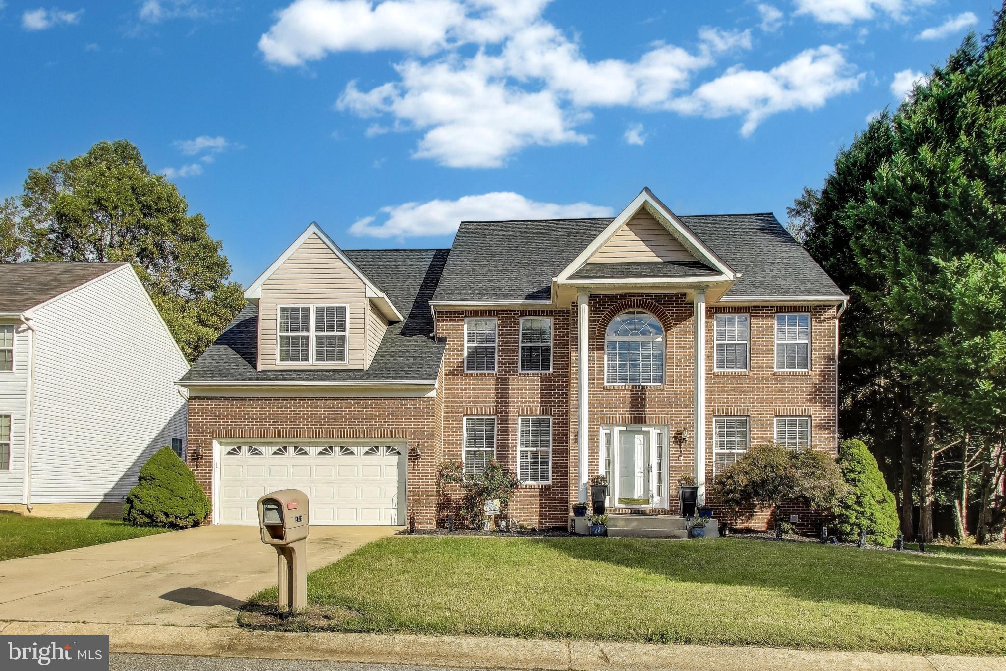 2323 Springdale Lane Waldorf, MD 20603 - Photo 2 of 51 a front view of a house with a yard