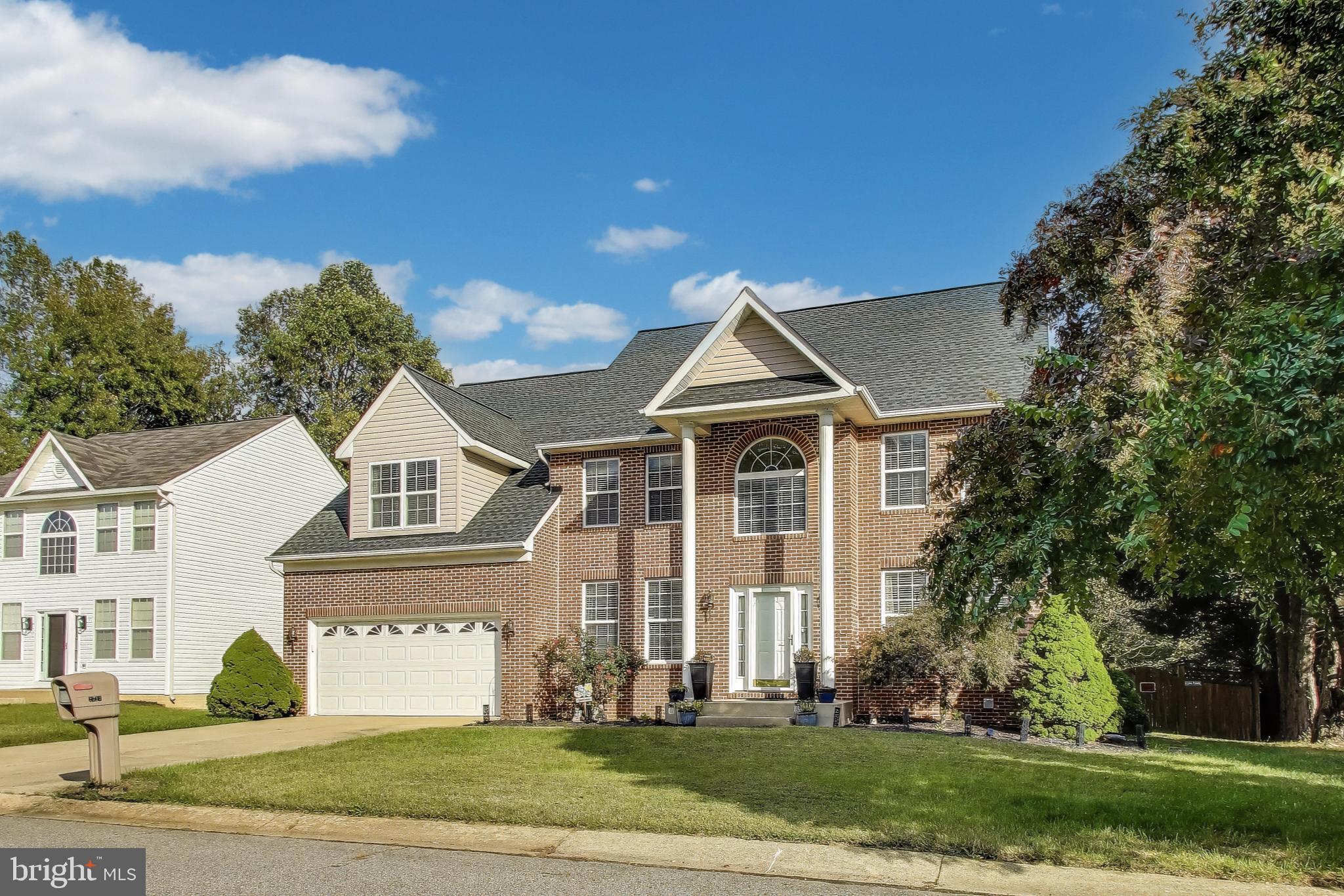 2323 Springdale Lane Waldorf, MD 20603 - Photo 3 of 51 a front view of a house with a yard