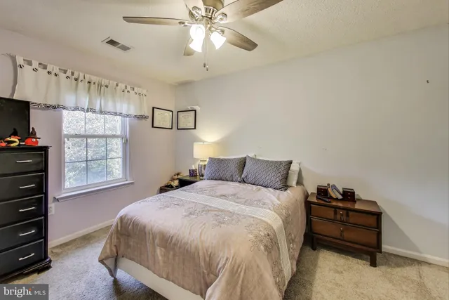 a bedroom with a bed and a closet