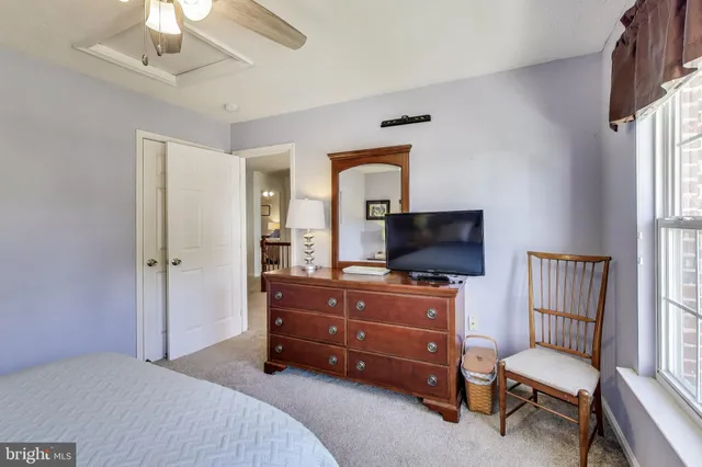 a bedroom with a bed and flat screen tv