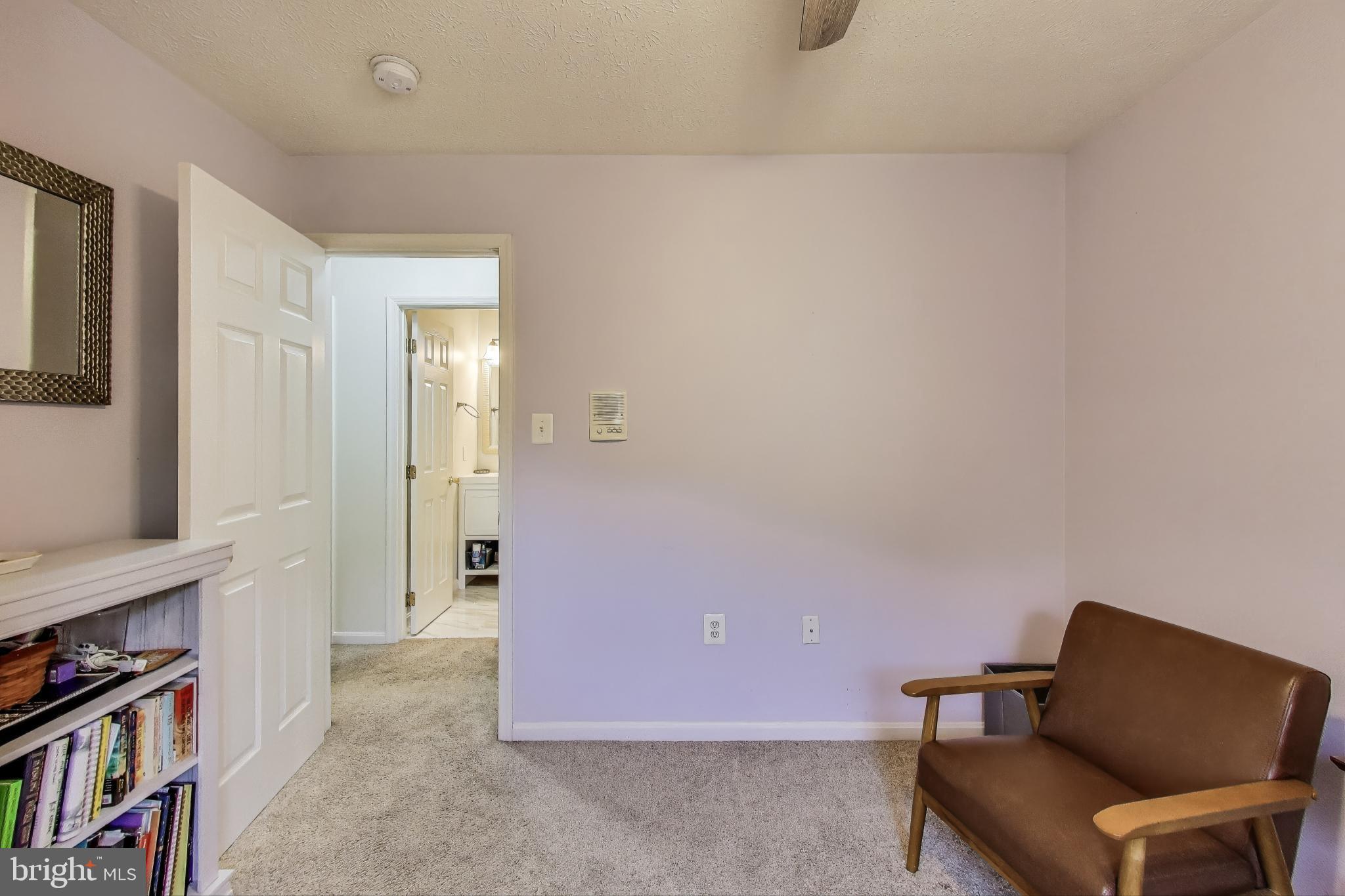 2323 Springdale Lane Waldorf, MD 20603 - Photo 36 of 51 a hallway with furniture and a bookshelf