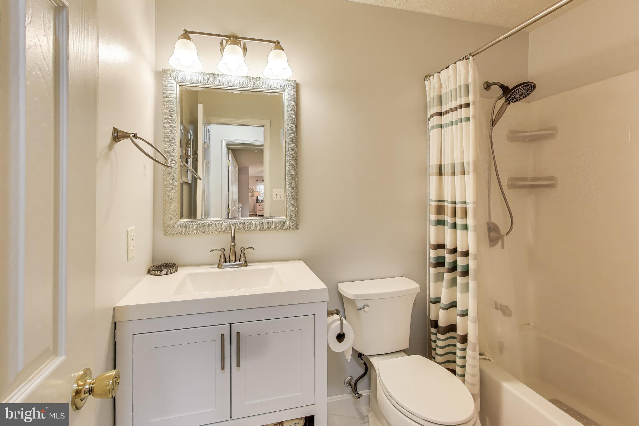 2323 Springdale Lane Waldorf, MD 20603 - Photo 37 of 51 a bathroom with a sink vanity mirror and toilet