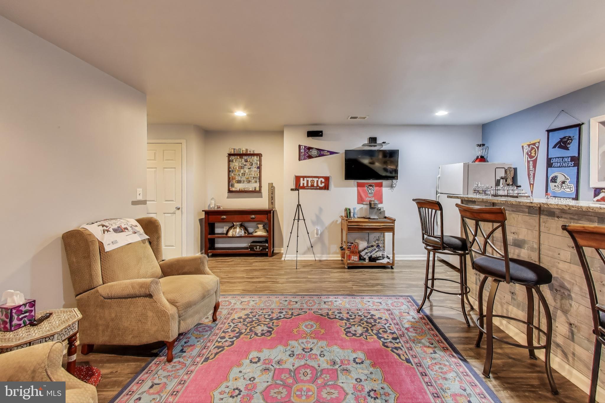 2323 Springdale Lane Waldorf, MD 20603 - Photo 41 of 51 a living room with furniture and a flat screen tv