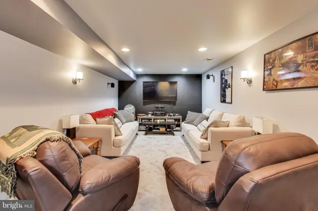 a living room with furniture a couch and a couch