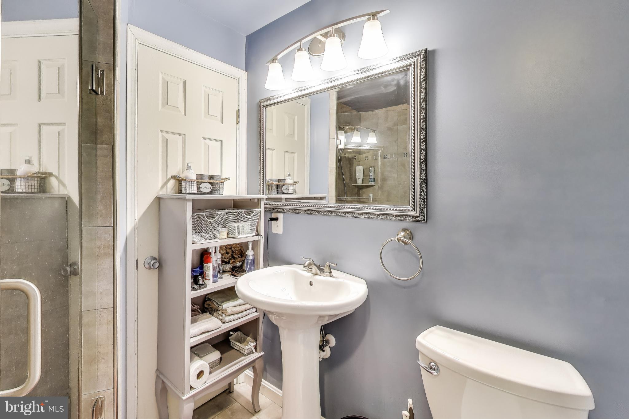 2323 Springdale Lane Waldorf, MD 20603 - Photo 46 of 51 a bathroom with a toilet sink and mirror