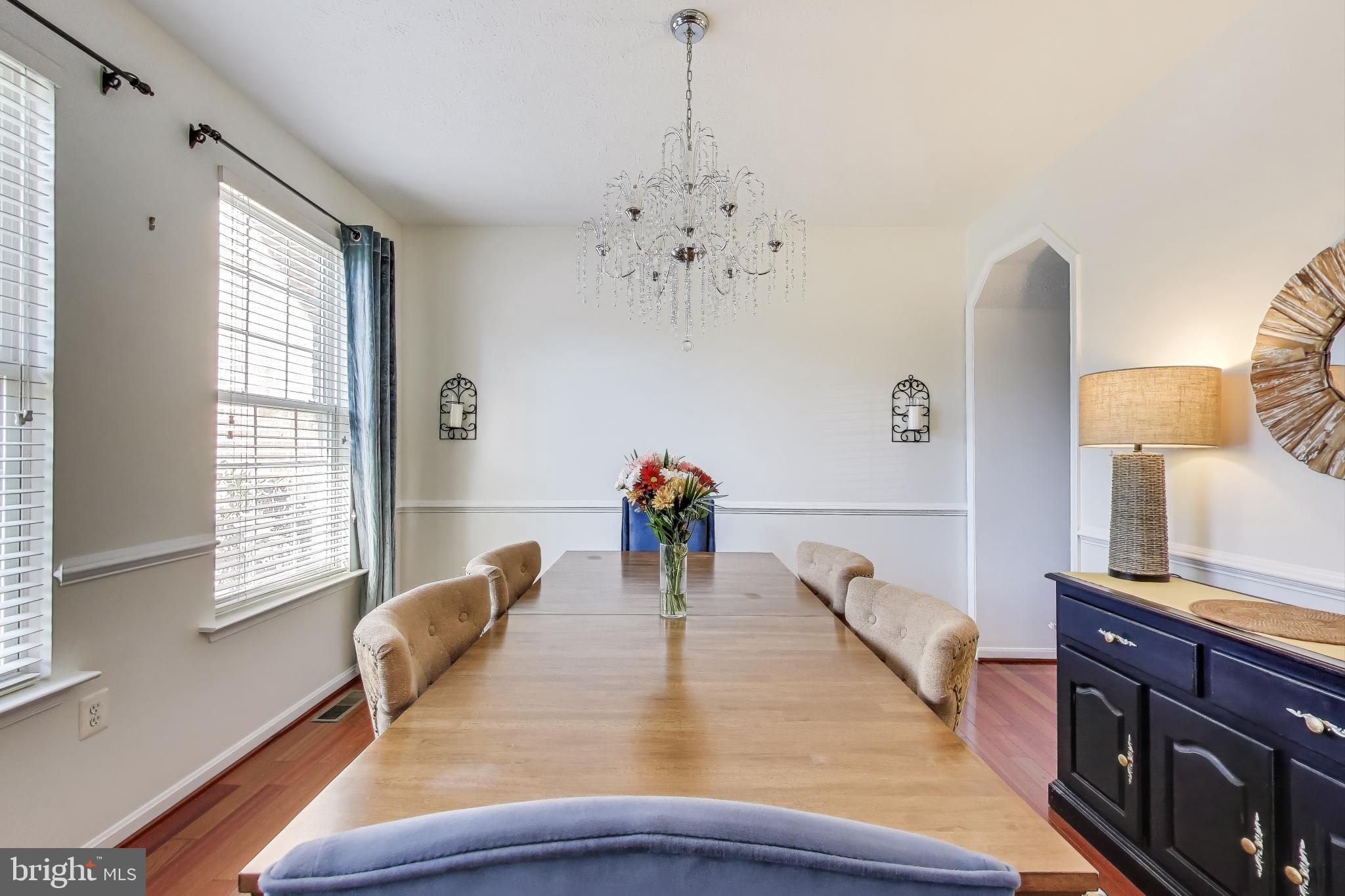 2323 Springdale Lane Waldorf, MD 20603 - Photo 8 of 51 a view of a dining room with furniture and a chandelier