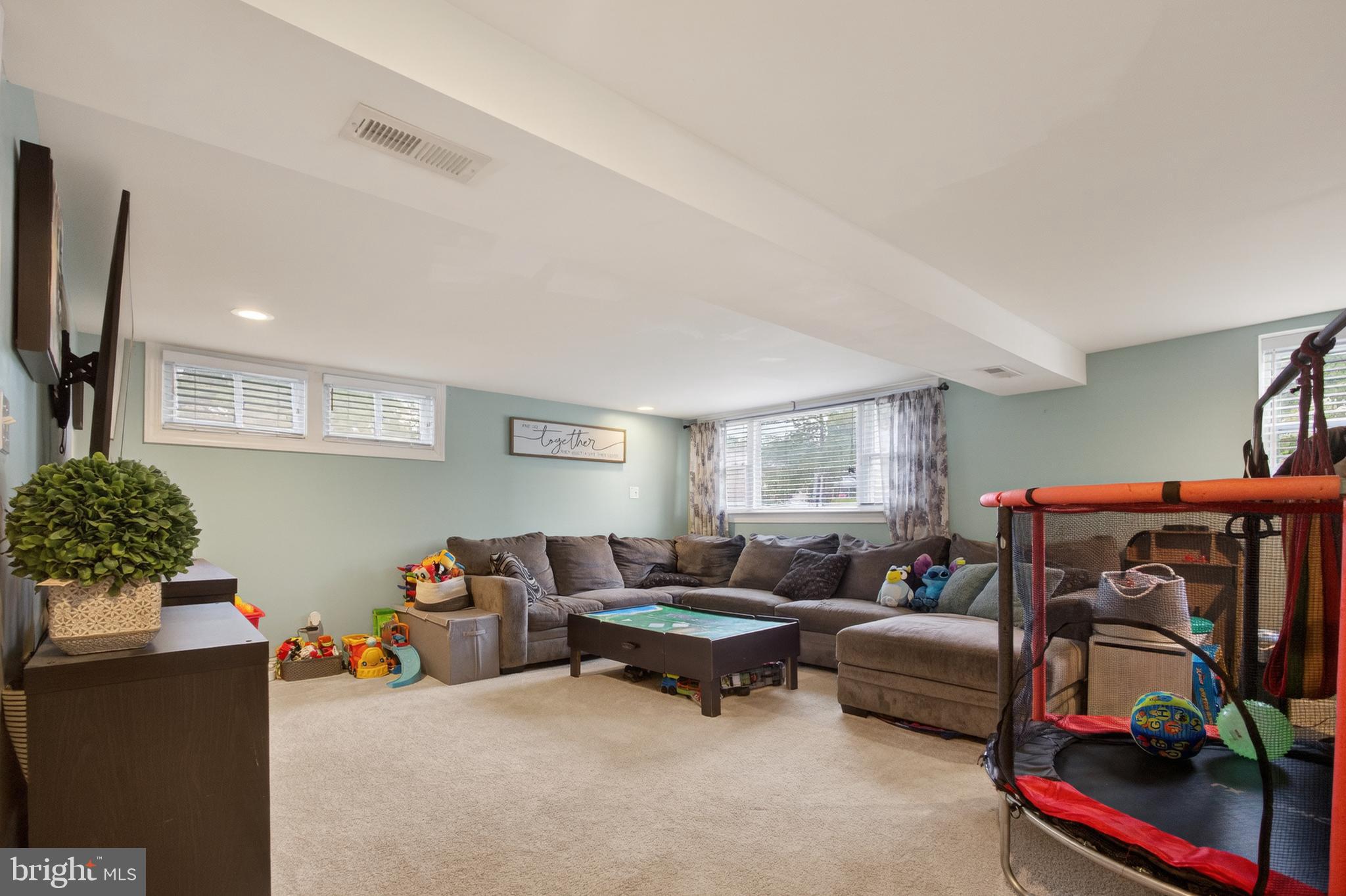 1123 Wynnbrook Road Secane, PA 19018 - Photo 5 of 14 a living room with furniture and a flat screen tv