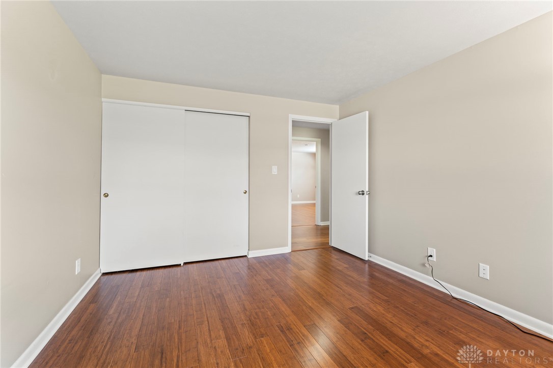 2247 East Whipp Road Dayton, OH 45440 - Photo 36 of 52 This spacious bedroom offers ample natural light and beautiful hardwood flooring.