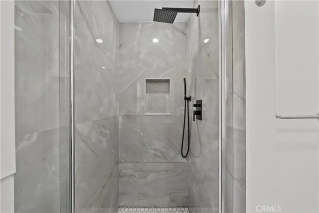 a kitchen with stainless steel appliances granite countertop a stove top oven a sink and a refrigerator