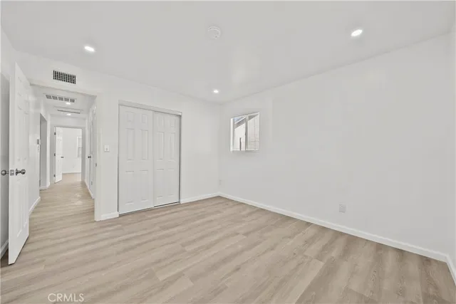 a bathroom with a granite countertop sink a toilet and a mirror