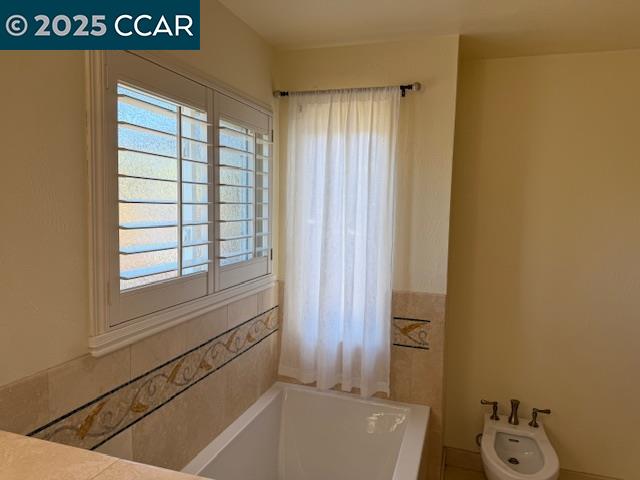 Dana Hills Clayton, CA 94517 - Photo 14 of 15 a bathroom with a bathtub and shower