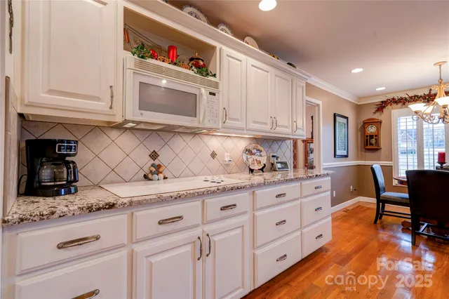 a kitchen with granite countertop cabinets and sink