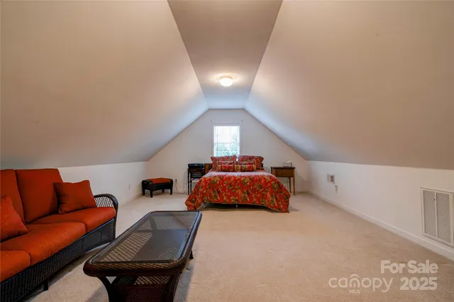 a bed room with a bed and a couch