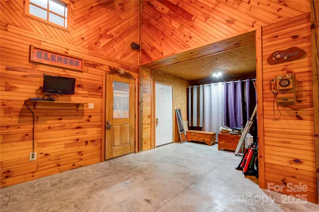 a view of a porch with wooden floor and a ceiling fan