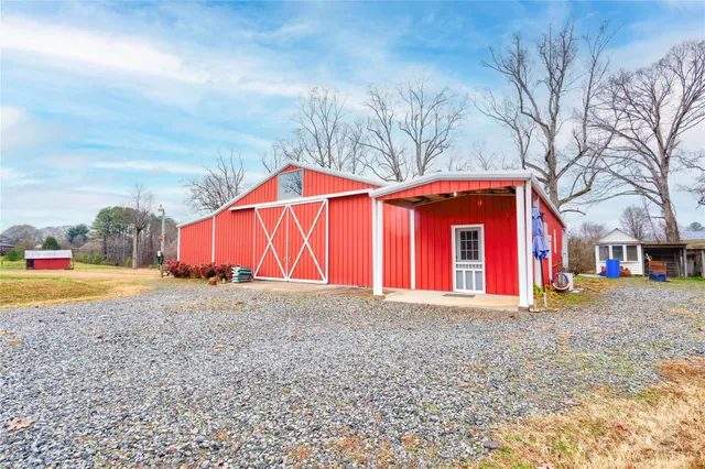 a view of a house with a yard and garage