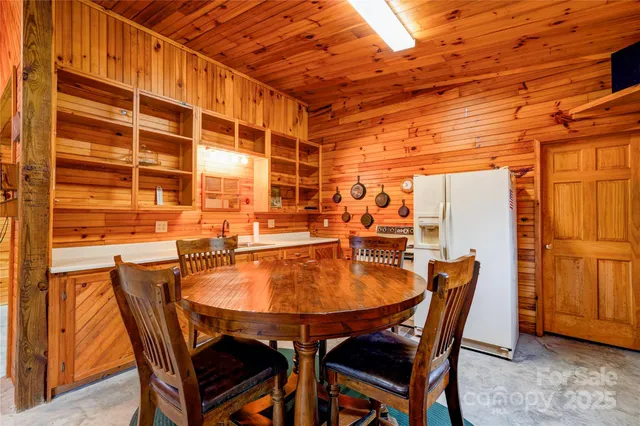 a dining room with a table and chairs