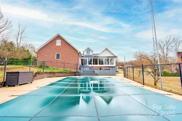 a view of a house with wooden deck and living space