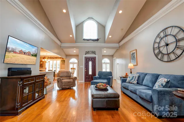 a living room with fireplace furniture and a flat screen tv