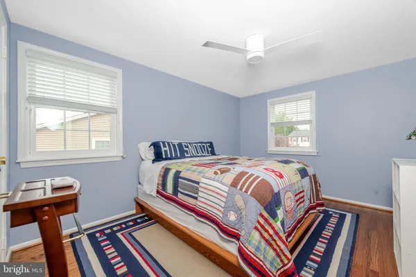 a bedroom with bed and a window