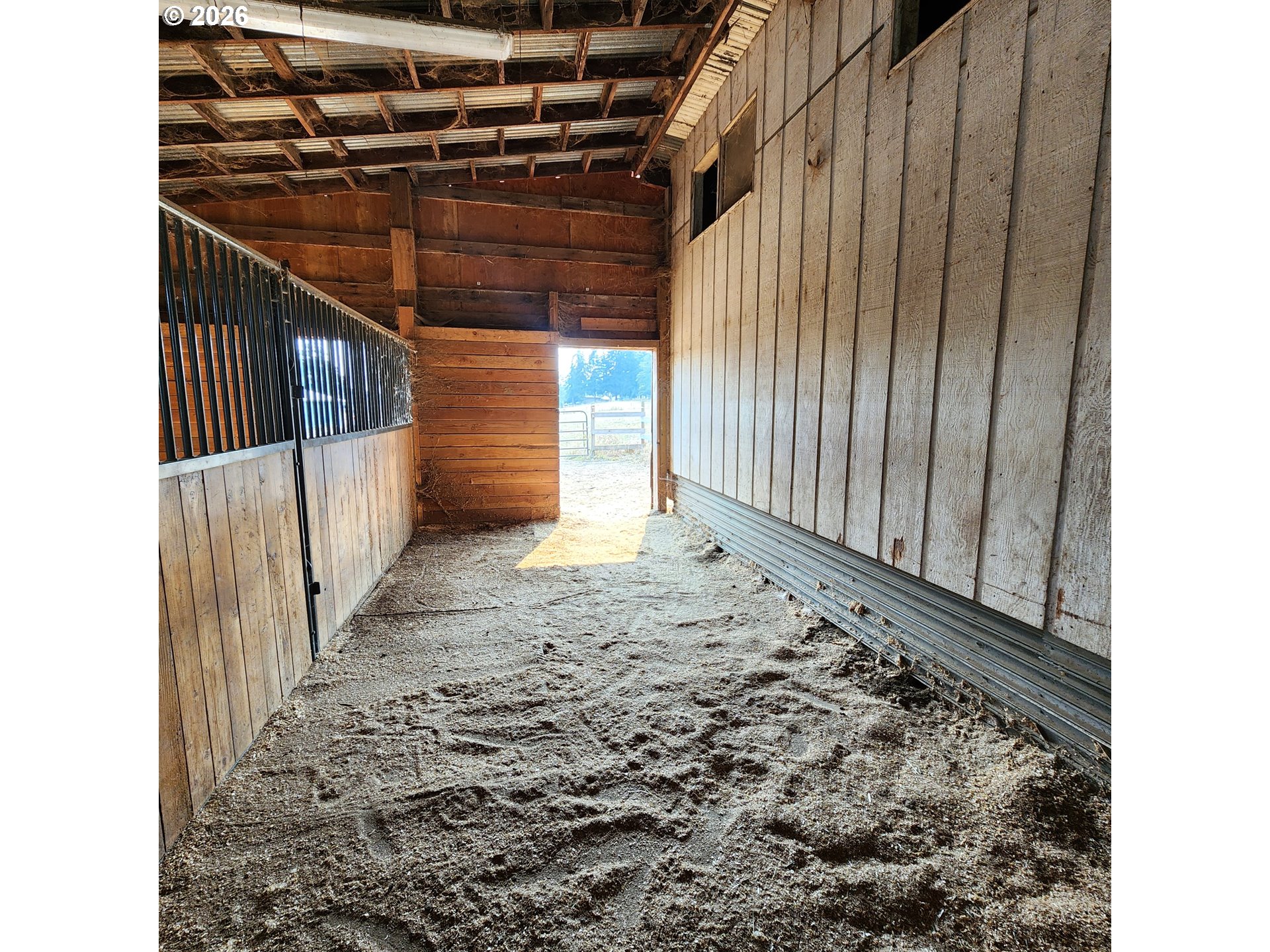 54047 West Lane Road Scappoose, OR 97056 - Photo 26 of 44 a view of an empty room with wooden walls