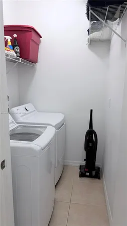 a view of a chairs and table in backyard