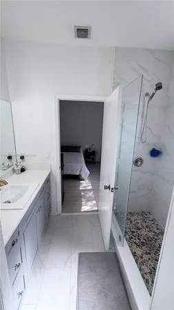 a view of walk in closet with clothes