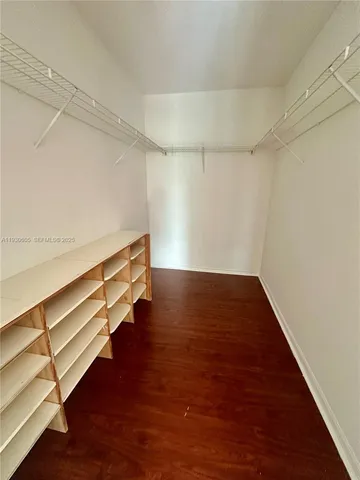 a view of room with wooden floor