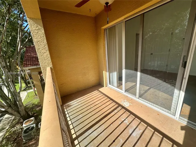 a view of balcony and wooden floor