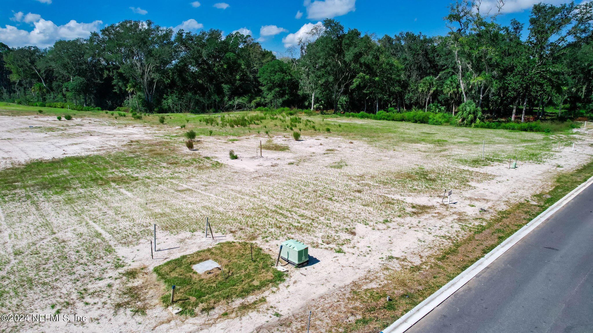 340 Shell Ridge Lane Ponte Vedra, FL 32081 - Photo 6 of 27 a view of dirt field with trees in the background