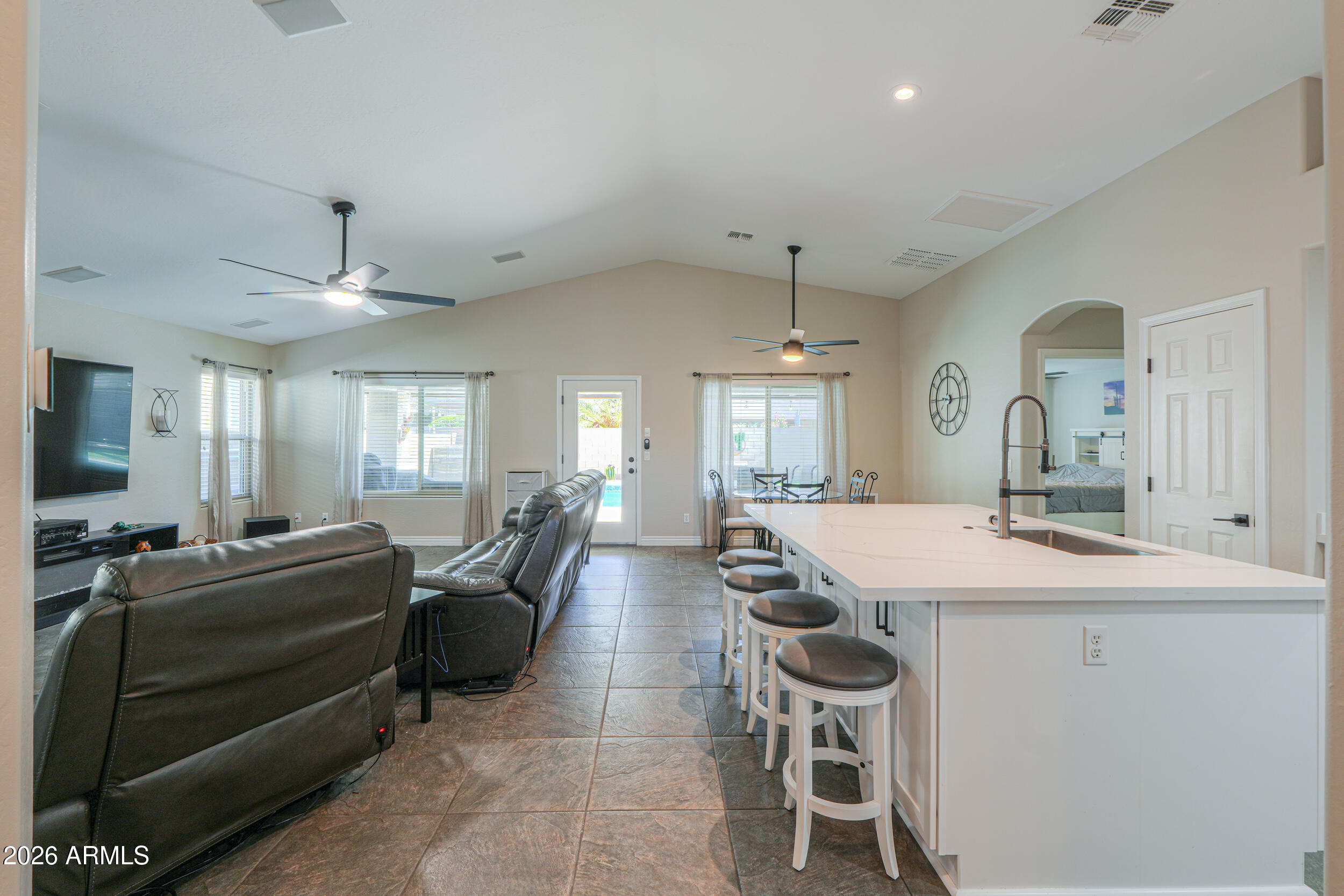 43843 Roth Road Maricopa, AZ 85138 - Photo 21 of 53 a dining hall with stainless steel appliances kitchen island granite countertop furniture and a kitchen view