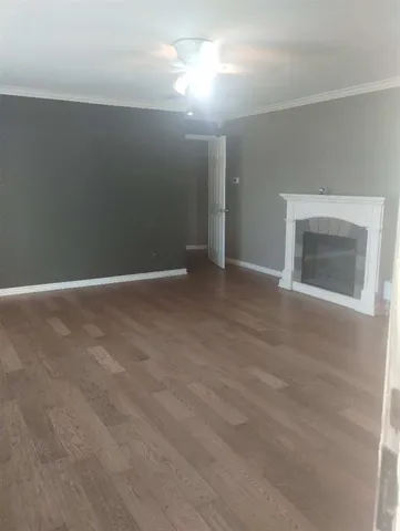 a view of an empty room with a fireplace