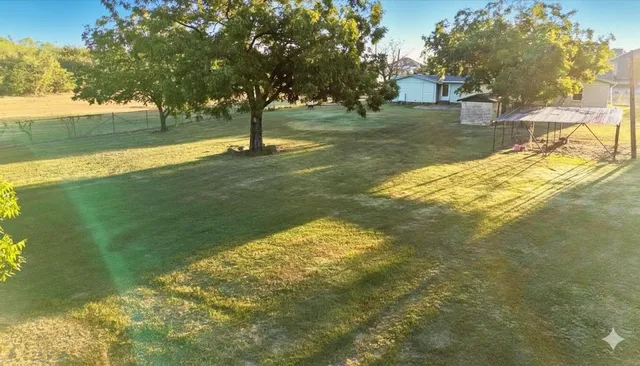 a view of yard with trees